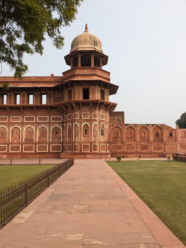 The red sandstone walls and arches of Agra Fort
