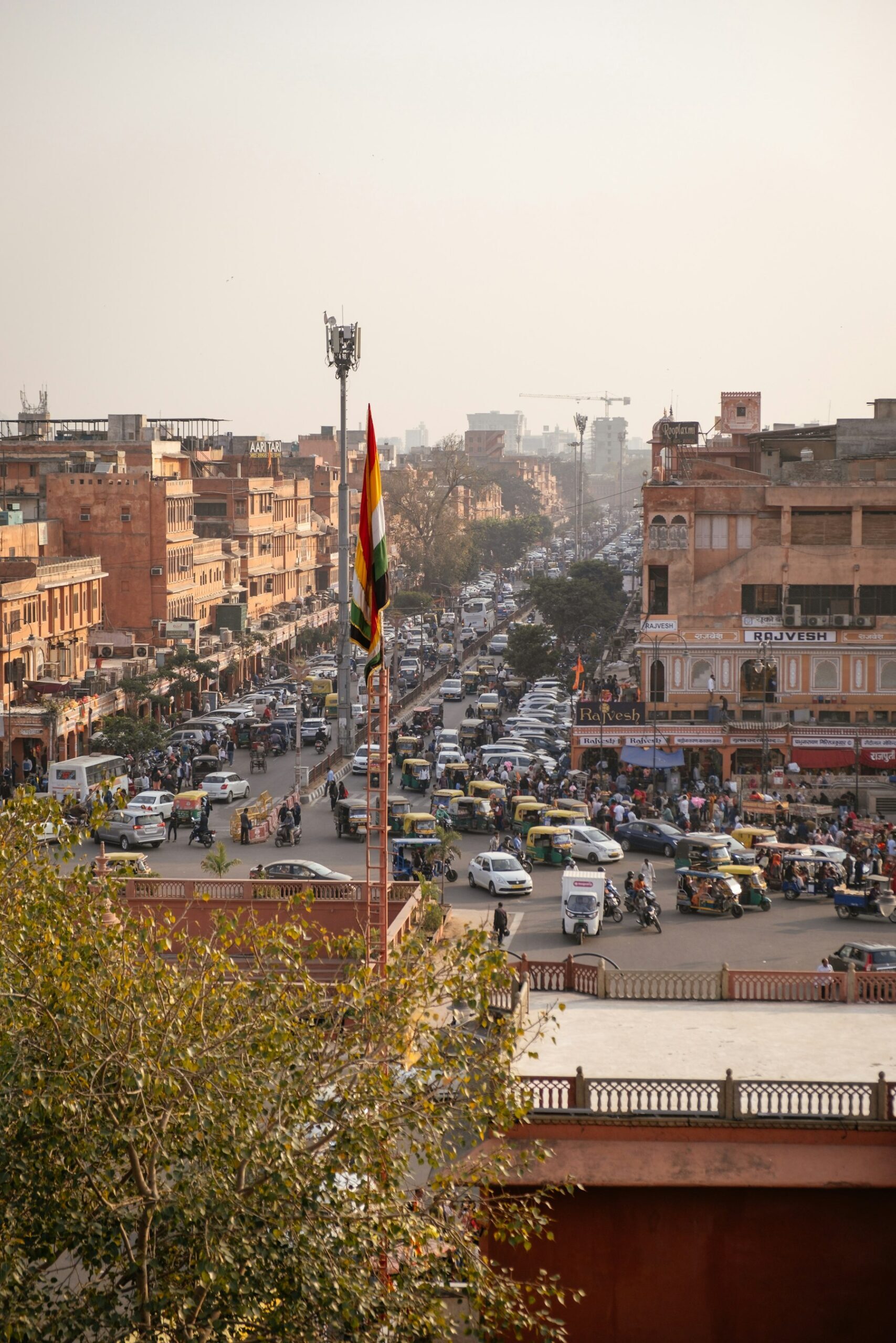 Traffic and rooftops of the old city of Jaipur seen from above