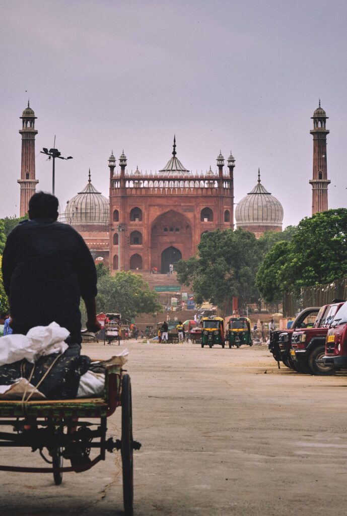 A cycle rickshaw passing the Jama Masjid in Old Delhi